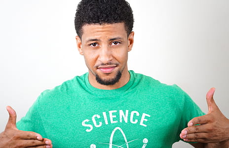 Man in Green T-shirt Posing for Photo thumbnail