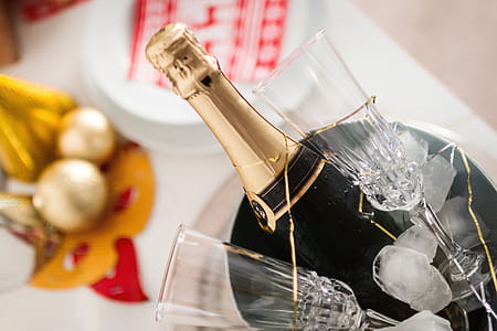 Party! Glasses and bottle of Champagne in an ice container. Happy New Year concept. thumbnail