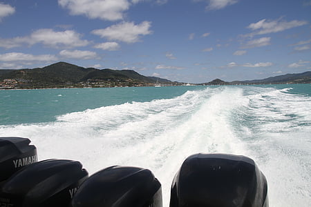 four black Yamaha outboard motors running with boat floating on sea thumbnail