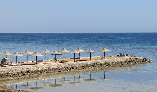 gray beach umbrellas at daytime thumbnail