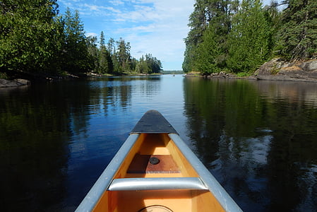 brown canoe on body of water thumbnail