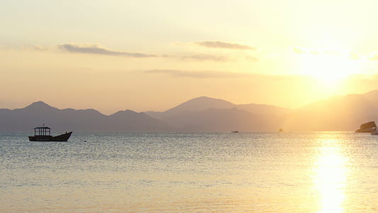boat on body of water during sunset thumbnail