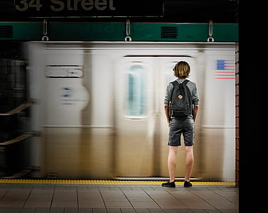 man standing on subway thumbnail