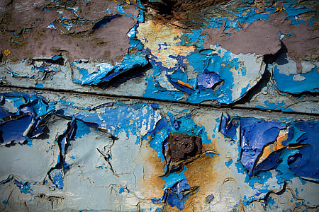 Close-up shot of some cracked and degraded blue wood. Image captured in Faversham, Kent, England with a Canon DSLR thumbnail