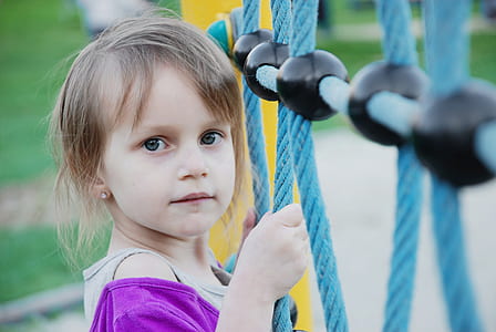 girl holding on blue rope thumbnail