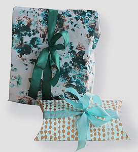 two rectangular white and green gift boxes on white surface thumbnail