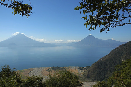 bird's-eye view of mountain beside body of water thumbnail
