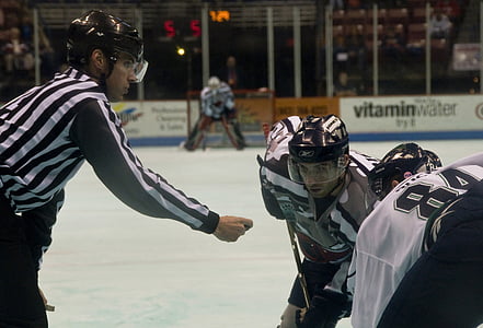 two ice hockey players in front of referee thumbnail