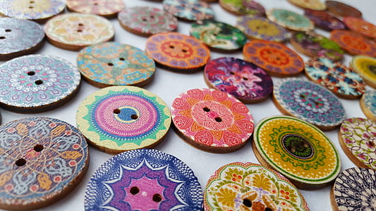 assorted-color coaster lot on white surface thumbnail