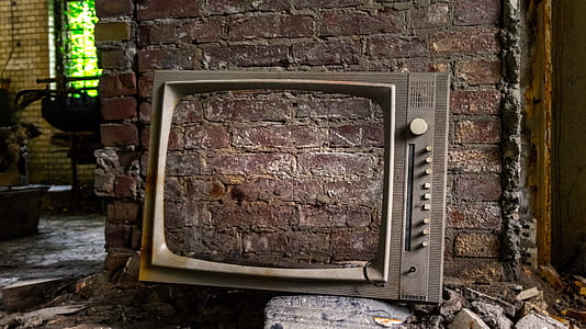 gray TV frame leaning on wall thumbnail