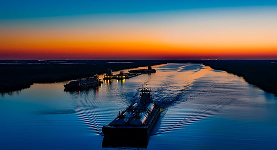 sunset near body of water thumbnail