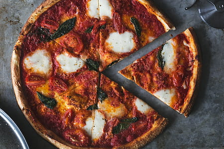 First Slice Of Fresh Margarita Pizza Photo thumbnail