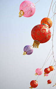 red and pink paper lanterns at daytime thumbnail