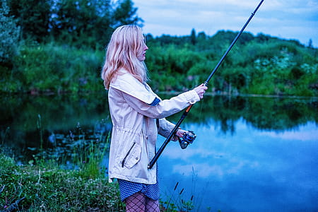 portrait photography of woman while fishing thumbnail
