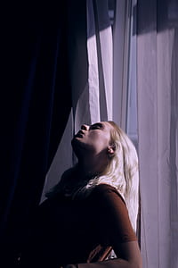 woman leaning on white curtain thumbnail