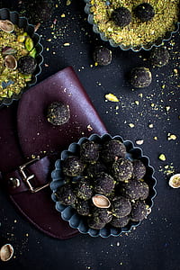 chocolate munchkins on cupcake molder on brown leather purse thumbnail