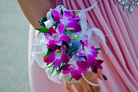 woman with purple flower bracelet on right hand thumbnail