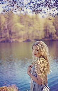 Woman Standing Near Body of Water thumbnail