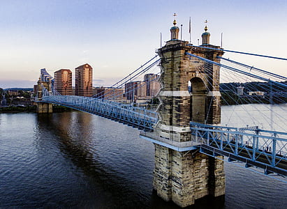 gray and brown bridge under blue sky at daytime thumbnail