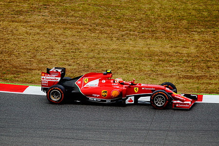 closeup photography of red and black Ferrari formula-1 race car during daytime thumbnail