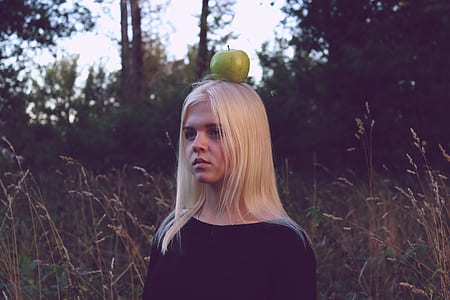 green apple on woman head thumbnail