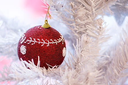 red and gray bauble hanging on white Christmas tree thumbnail