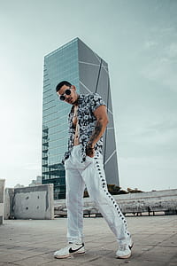 man standing on gray concrete floor thumbnail