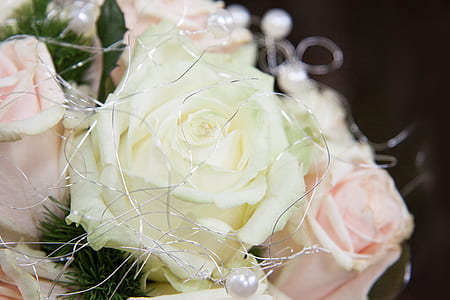 close-up photo of white and pink faux rose arrangement thumbnail