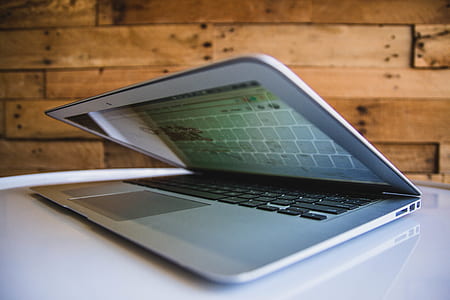 white laptop computer turned on thumbnail