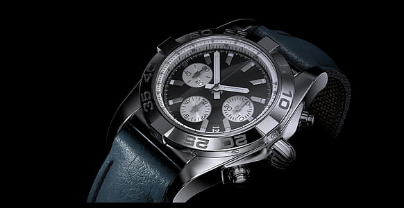 closeup photo of round silver-colored chronograph watch with black leather band thumbnail