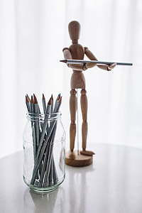 Wooden mannequin in various poses thumbnail