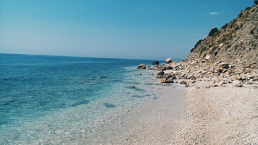 Grey Rock Formation Near Blue Beach during Daytime thumbnail