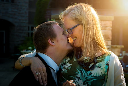 closeup photo of woman hugging manduring daytime thumbnail