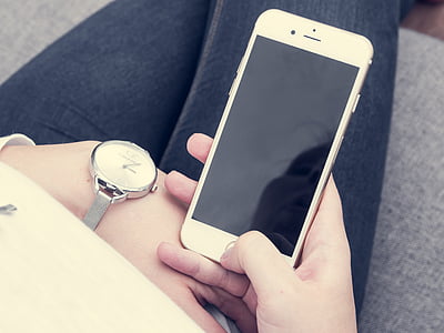 person holding gold iPhone 6 thumbnail