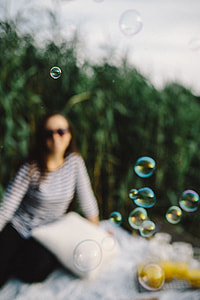 Having fun with soap bubbles in the nature thumbnail