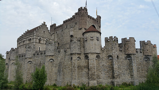 gray concrete castle under cloudy sky thumbnail
