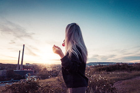 Young Millennial Girl Drinking Lemonade and Overlooking the City thumbnail