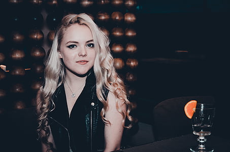 woman wearing black leather sleeveless jacket thumbnail