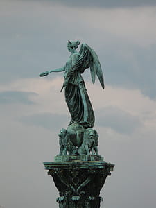 woman angel and lions statue thumbnail