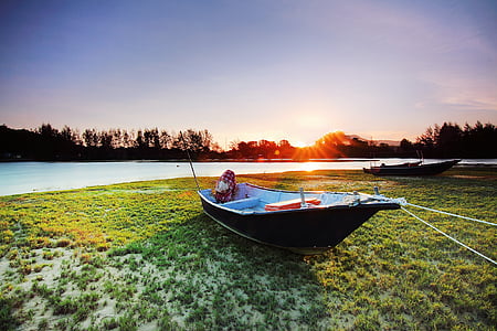 canoe on green field thumbnail