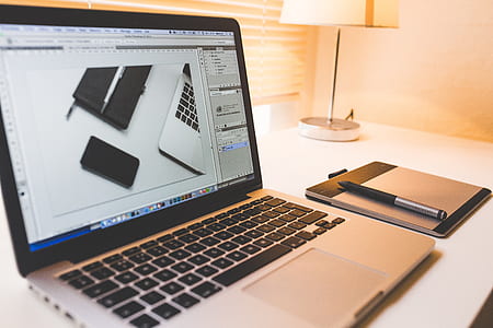 turned on MacBook Pro with traction pad and pen thumbnail
