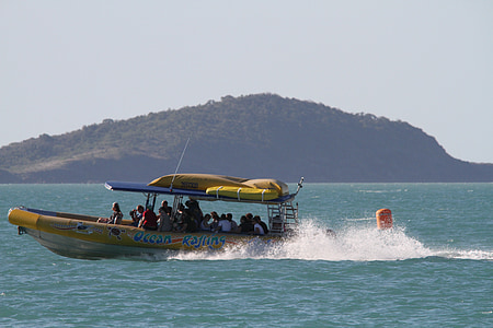 yellow motorboat in body of water thumbnail