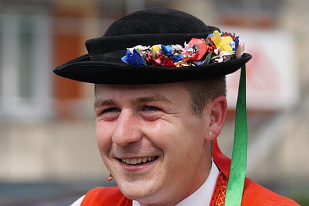 man wearing black floral hat thumbnail