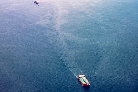 Red, White, and Teal Cargo Ship on Water thumbnail