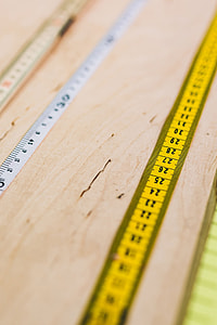 Close-ups of rulers on a wooden table thumbnail