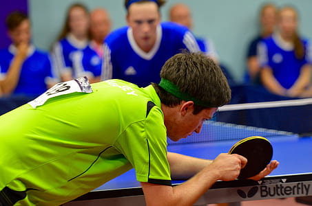 table tennis player leaning on table thumbnail