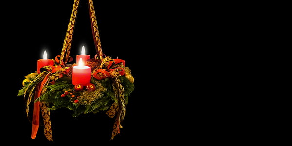 lighted three red pillar candles thumbnail