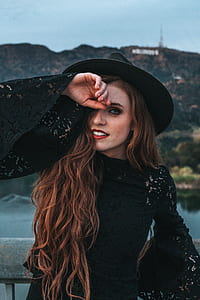 woman wearing black costume during daytime thumbnail