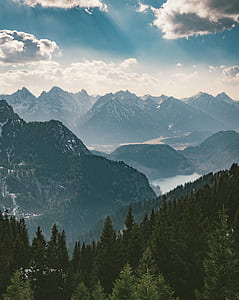 mountain range under blue cloudy sky thumbnail