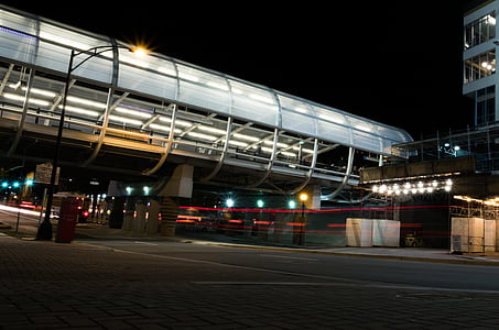time lapse photography of vehicle passing under bridge during nighttime thumbnail